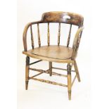 A 19th century ash and elm bentwood tub chair, the turned gallery back above an embossed solid seat,