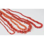 Four coral and coral coloured bead necklaces, to include graduated beads,