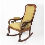 A Victorian carved mahogany rocking chair,