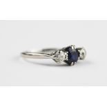 A sapphire and diamond three stone ring,