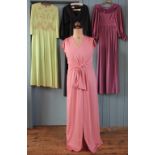 A collection of fourteen vintage dresses primarily from the 60's and 70's,