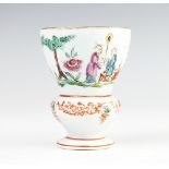 A 19th century Chinese famille rose duck egg cup, with ogee shaped bowl and baluster lower section,