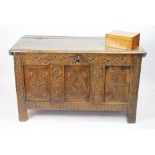 An 18th century and later oak coffer, with hinged top and later carved floral detailing,