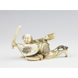 A Japanese ivory okimono of a ratcatcher,