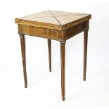 An Edwardian brass inlaid mahogany envelope card table, 76.