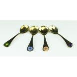 Four Georg Jensen silver gilt year spoons, each enamelled with a different flower, 1976, 1980,