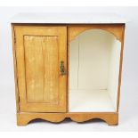 An Edwardian painted pine wash cabinet, with marble top and cupboard door, on bracket feet,