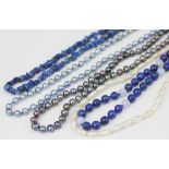 Two strands of uniform dyed cultured pearls in silver/grey and silver/blue colours along with a