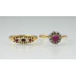 A ruby and diamond circular cluster ring, the central ruby within a diamond set surround,