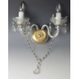 Six cut glass twin branch wall lights with scroll centre arm and circular back plates,