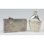 A silver vesta case in the form of a bottle in a basket, Adie and Lovekin, Birmingham 1909,