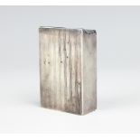 An unusual silver rectangular match box with spring loaded flaps for wind-proofing,
