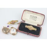 Two ladies gold watch faces along with a diamond set Victorian bar brooch a further brooch and a