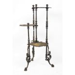 A Victorian cast iron three tier jardiniere stand, cast with birds and flowers,