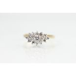 A diamond set ring, designed as a marquise shaped panel set with fifteen brilliant cut diamonds,