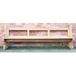 A Victorian pitch pine pew / bench, with open back and solid seat,