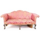 A George II style carved mahogany bow front salon settee, with serpentine back and scroll ends,