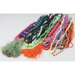 A box containing a selection of assorted bead necklaces,