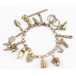 A 9ct yellow gold slender curb link charm bracelet hung with assorted charms, to include; a hare,