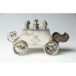 An Edwardian novelty silver table spirit lighter in the form of a four wheeled carriage,