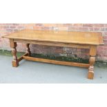 A Theo Davies of Glyn Ceriog 17th century style golden oak refectory type table,