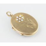 A 9ct yellow gold and seed pearl set locket, Birmingham 1969,