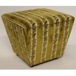 A Victorian ottoman stool, of tapering form, with hinged lid, on wood castors,