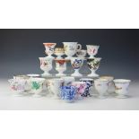 A collection of twenty three 19th century and later egg cups, mostly Coalport,