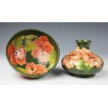 A Moorcroft Hibiscus pattern vase, of squat ovoid form, peach blooms against a green ground, 9.