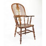 A 19th century beech, ash and elm country Windsor chair, with hoop back and solid seat,