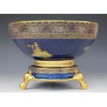 A large Carltonware chinoiserie bowl on stand, decorated with figures, pagodas and birds,