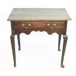 A mid 18th century oak low boy, with a moulded edge and drawer, on cabriole legs and pad feet,