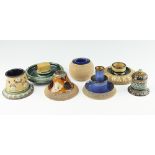 A selection of Royal Doulton and Doulton Lambeth stoneware, ash trays, strikers and match holders,