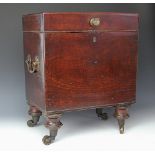 A late George III mahogany cellarette, with hinged lid and brass handle and swing handles,