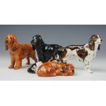 A collection of four Royal Doulton Cocker Spaniel ornaments, to include; HN2517,