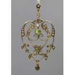 A peridot and seed pearl set Art Nouveau pendant,