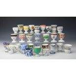 A collection of twenty nine 19th century and later egg cups, mostly Spode,
