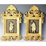 A pair of early 19th century continental ivory figures, each carved as street pedlars,