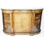 A Victorian inlaid walnut credenza, with panelled door and two curved glazed doors, on plinth base,