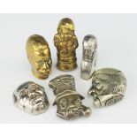 A collection of seven vesta cases, to include; a late 19th century brass negro's head 5cm high,