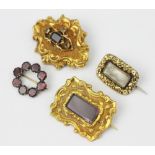 Four Victorian mourning or memorial brooches,