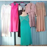 A collection of sixteen vintage dresses and garments,
