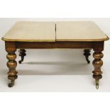 A Victorian mahogany extending dining table, with moulded edge and rounded corners,