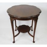 A late Victorian mahogany two tier occasional table, 71cm H x 73cm diameter,