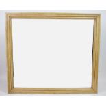 A modern stained pine rectangular wall mirror,