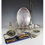 An assortment of silver and plated wares, to include a pair of silver mounted glove stretchers,