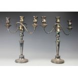 A pair of silver plated twin branch candelabra,