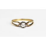 A diamond solitaire ring, the brilliant cut diamond within illusion white metal setting,