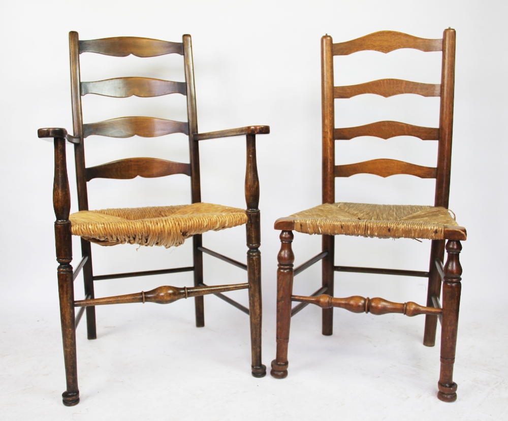 A set of six 19th century style stained beech ladder back chairs,