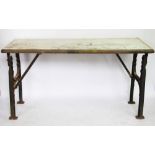 An industrial cast iron table, with ply wood top, 80cm H x 153cm W x 61cm D,